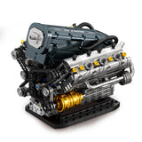 Moteur V6 en briques Reobrix, vue 3/4 avec collecteurs et culasse grise