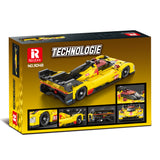 Boîte de construction REOBRIX TECHNOLOGIE montrant hypercar jaune aux détails rouges