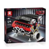 Boîte de construction avec moteur en briques noir et rouge sur présentoir