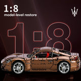 Voiture de construction télécommandée brun, vue latérale, intérieur rouge et jantes chromées